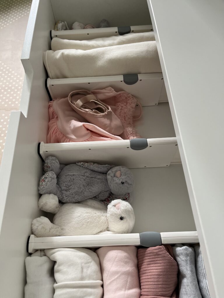 a neat drawer with baby items