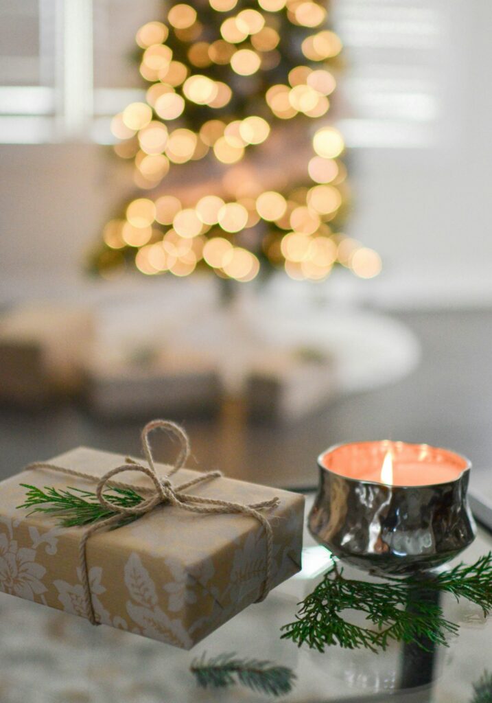 single Christmas gift and candle