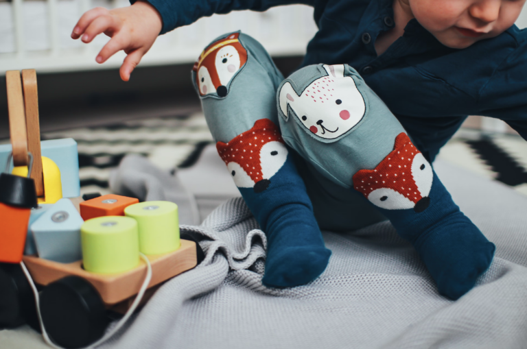 toddler wearing blue socks